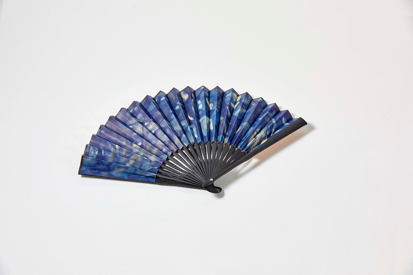 Folding fan / botanical leather® indigo dye / spotted / cowhide