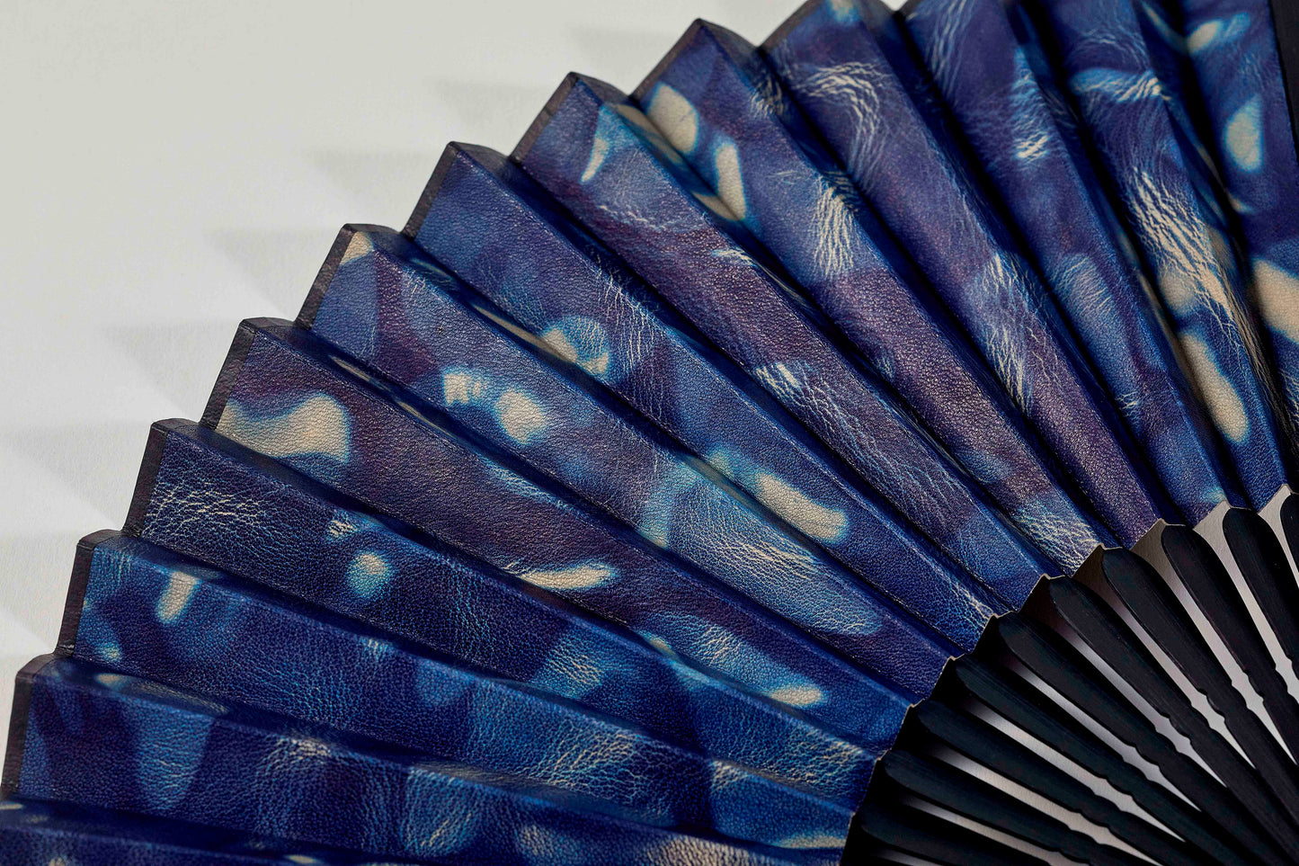 Folding fan / botanical leather® indigo dye / spotted / cowhide